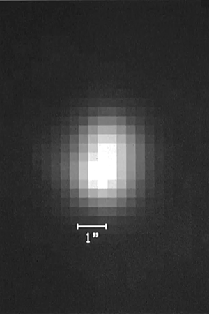 The first image is a complete blur–just white pixels in the middle of black pixels. The second shows more resolution. Still white pixels against the background of space, but better able to discern finer details.