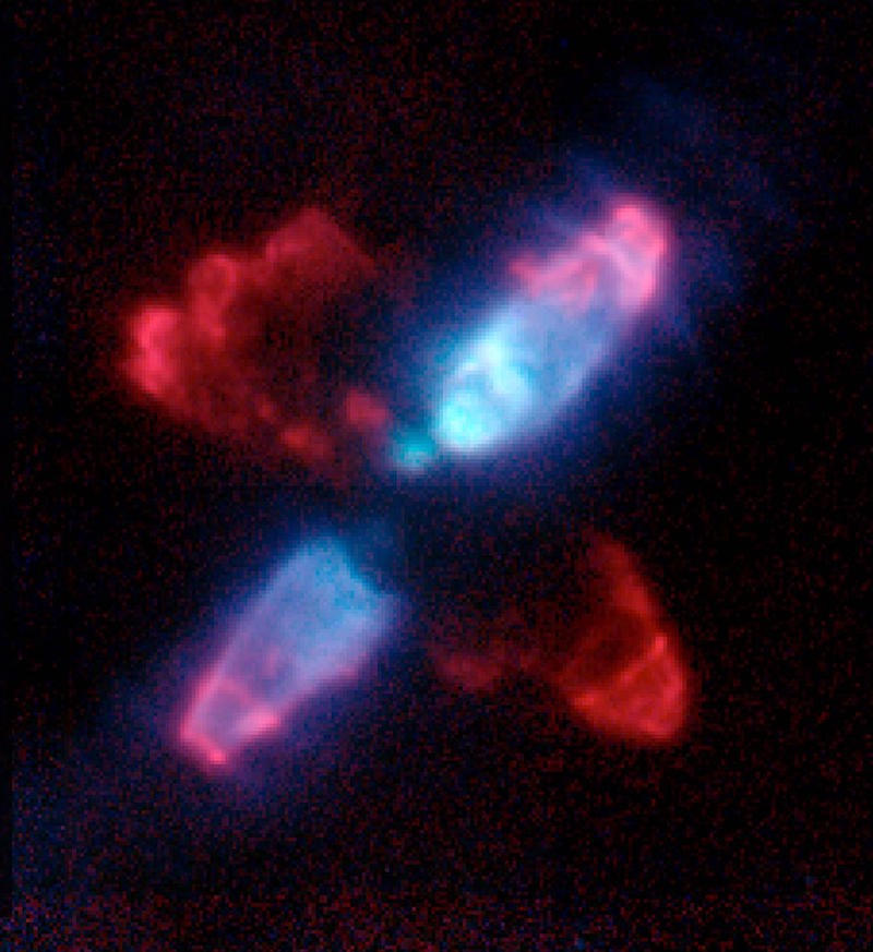 A cross-shaped nebula. One of the crossed arms is blue, the other crimson.