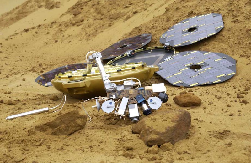 The Beagle 2 lander fully deployed as a circle of circular solar panels around a central robotic unit.