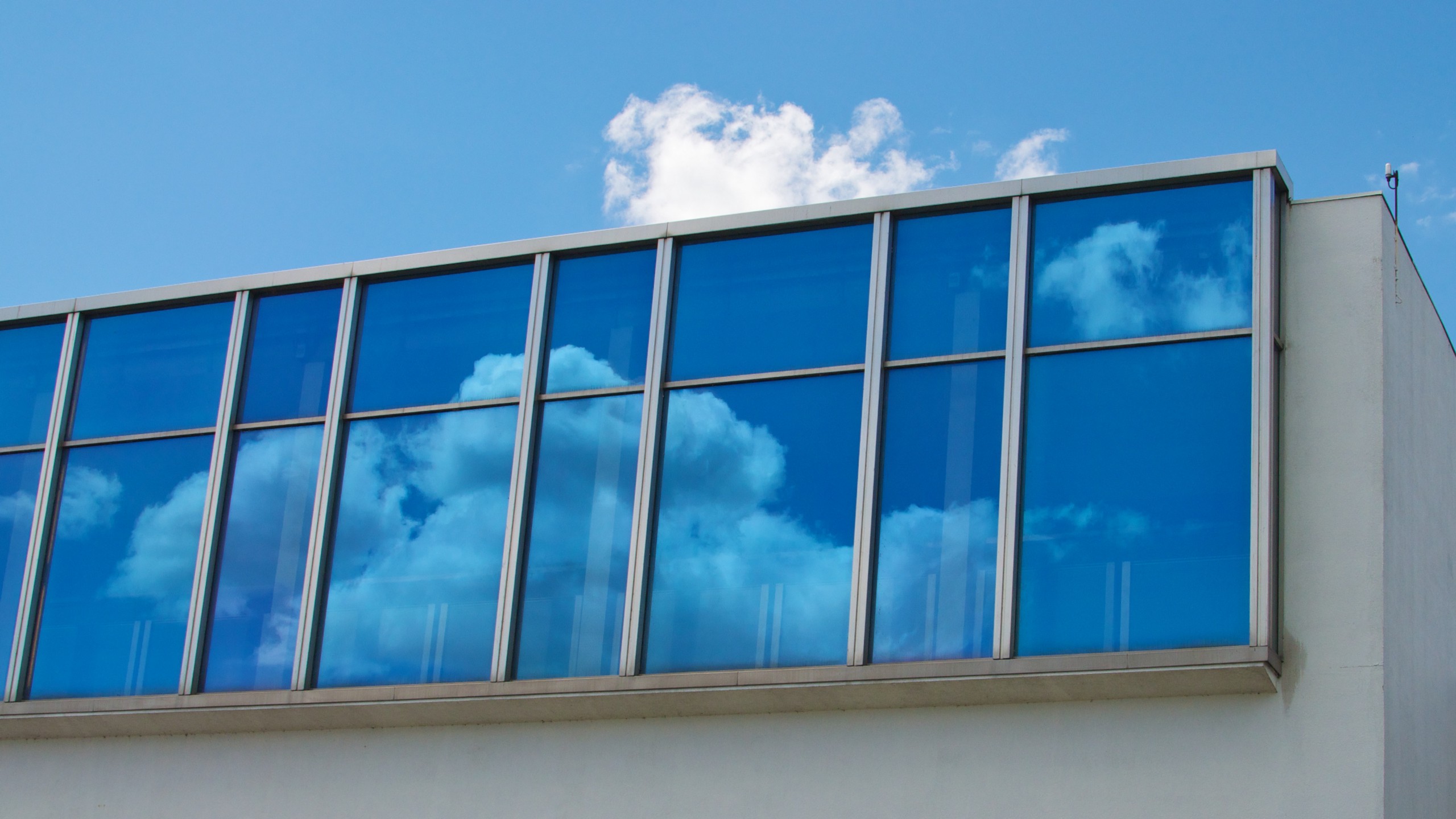 Clouds reflected in windows.