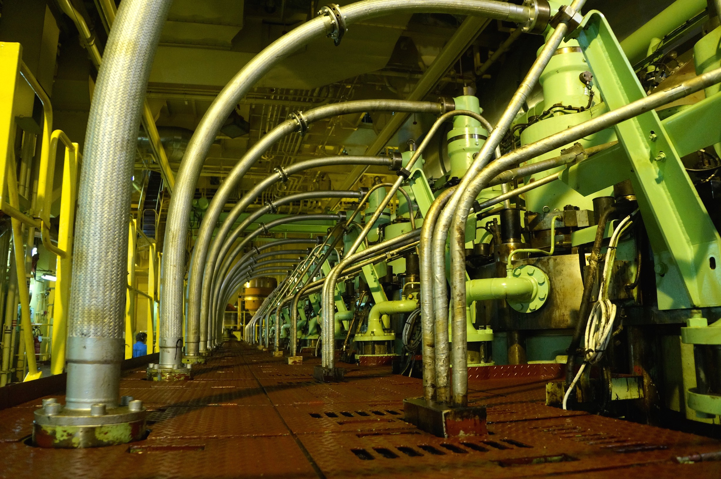 Pipes and other machinery fill the engine room.