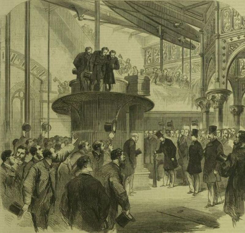 A large crowd of men in top hats, some of them waving them in celebration, watch as one of their number turns a tap to open the drainage works.