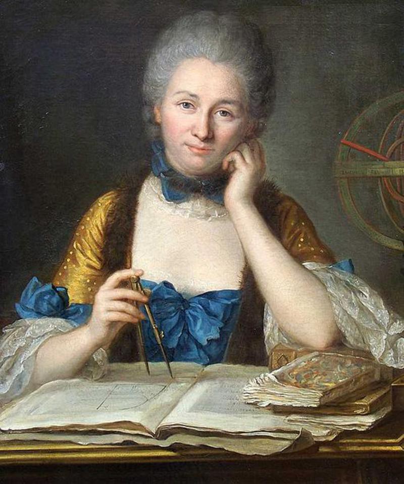 A woman in formal Georgian clothing sits at a table in front of books and papers, holding a compass.