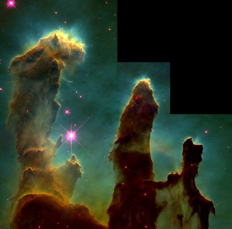 Brown-yellow cloud arms extend vertically against a dark green background, with purple stars scattered throughout.