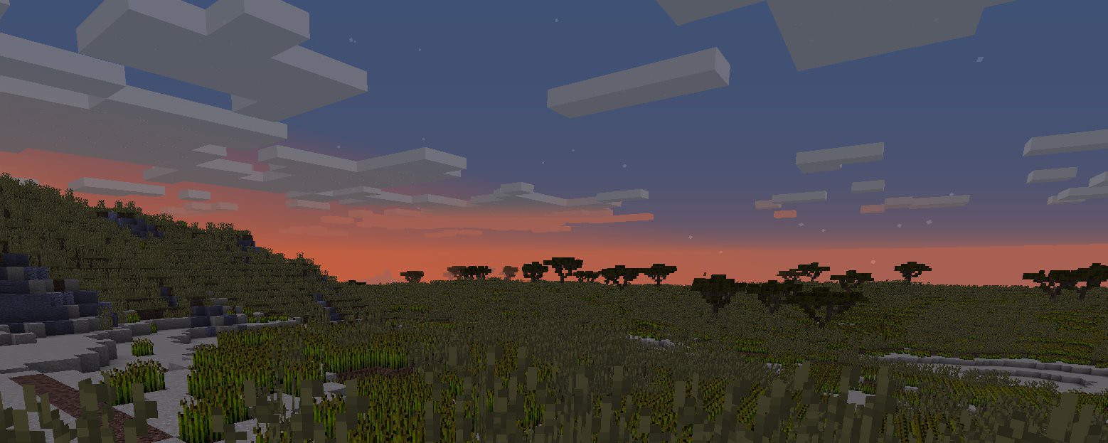 The sun sets over a savannah landscape made of large blocks, in the game Minecraft.