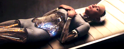 A clip from the movie "Ex Machina," with Alicia Vikander's robot character attaching her arm to her torso, then lying on a bed.