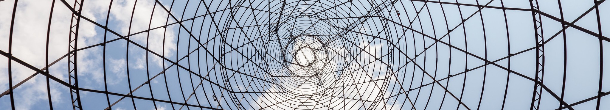 A lattice metalwork structure spiraling upwards.