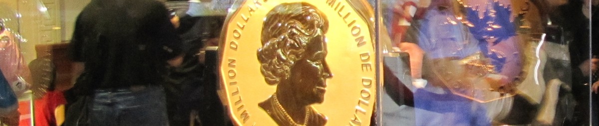 A golden coin with a picture of Queen Elizabeth II on it.