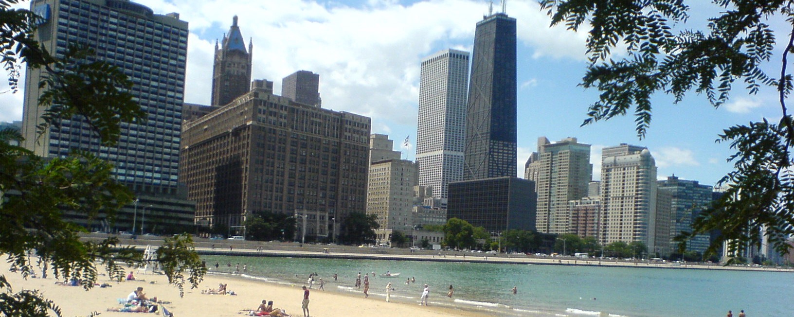A beach in downtown Chicago, with sunbathers and swimmers.