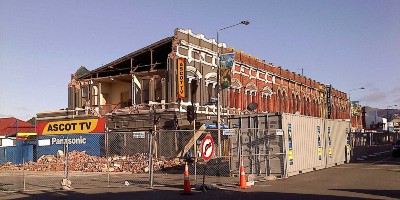 A row of stores, with the ones at the end collapsed.