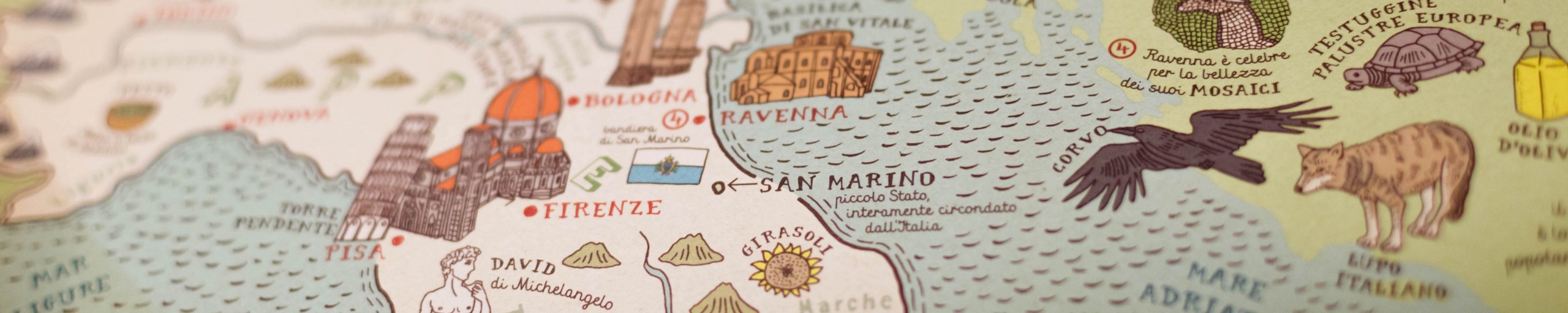 A close-up photo of a map of the Italian peninsula, centered on Pisa/San Marino/Ravenna.