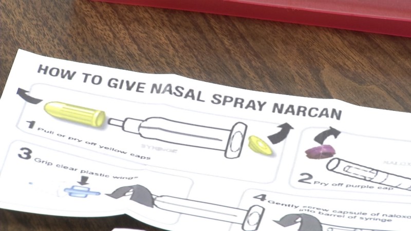 A pamphlet explaining how to give Narcan as a nasal spray.