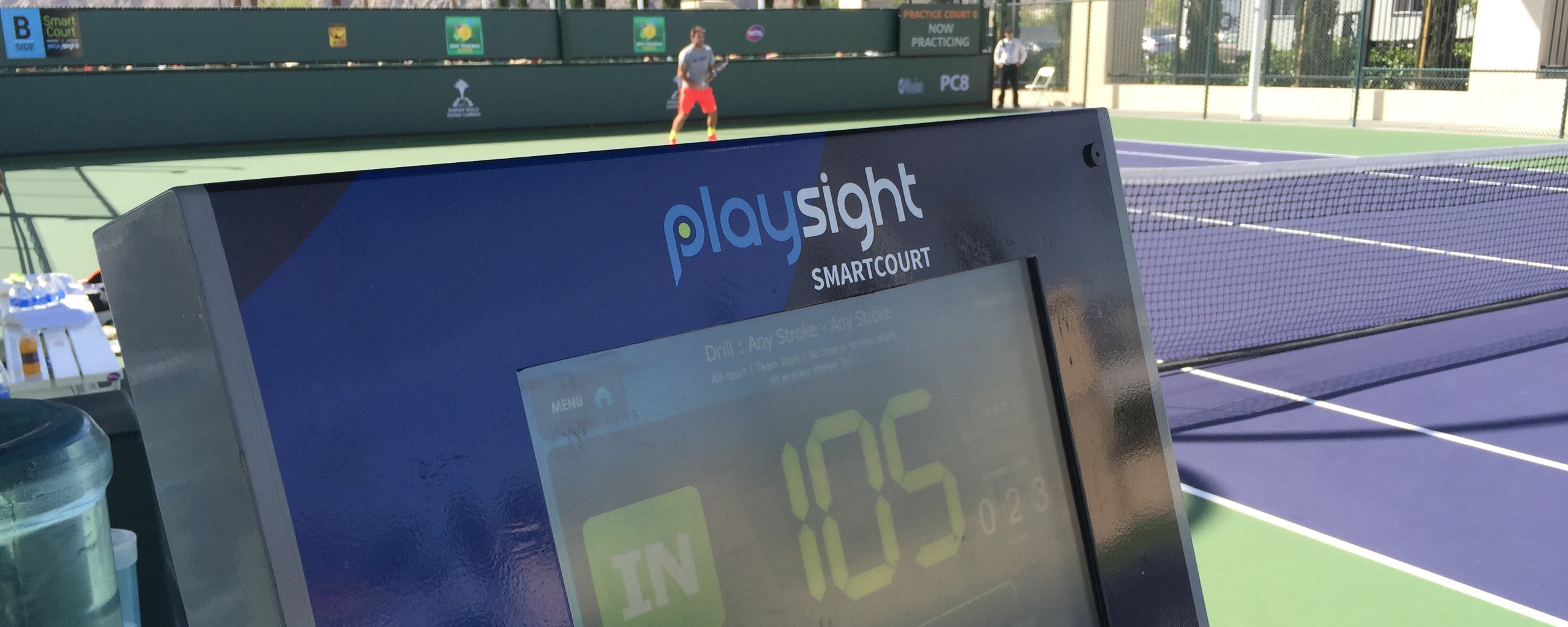 A computer monitor on a tennis court