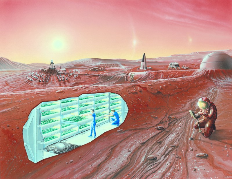The red surface of Mars is mostly barren except for an astronaut in a red spacesuit and a small number of surface buildings; a cutaway illustration shows humans beneath the surface working on an underground farm.