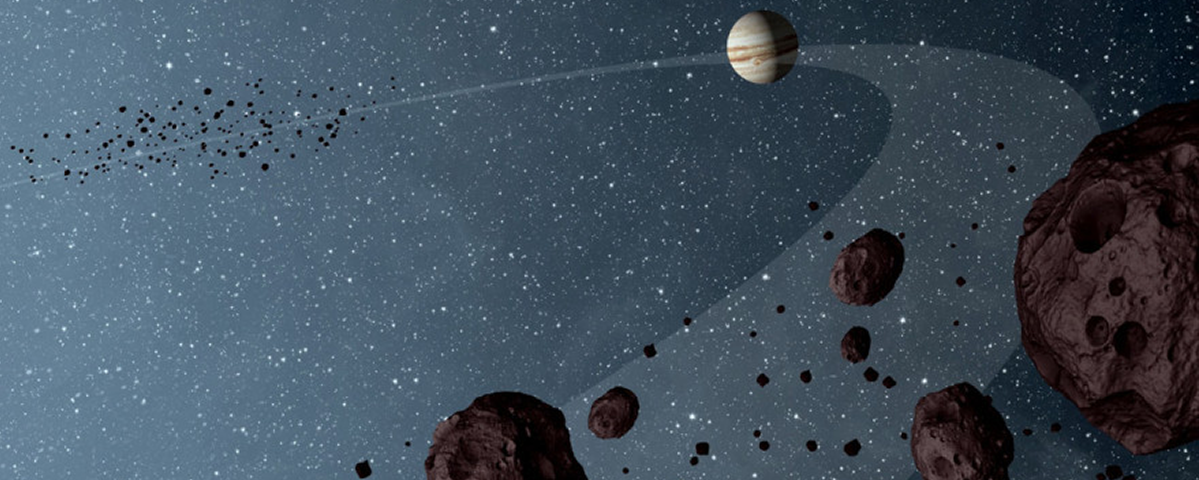 An illustration of the Solar System's Asteroid Belt, with Jupiter in the distance.