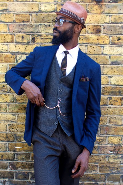 A black man in a blue suit.
