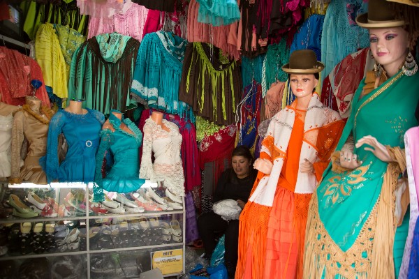 A store with Aymara clothing and hats on display.