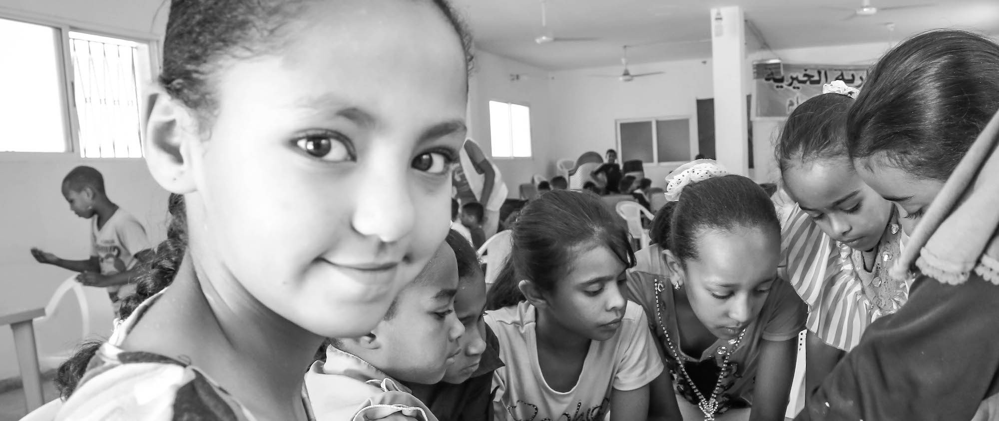 A group of girls in a classroom.