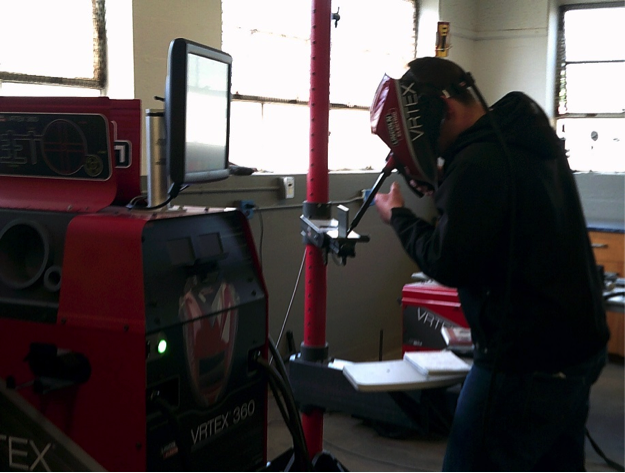 A person in virtual welding mask, using a virtual welding device.