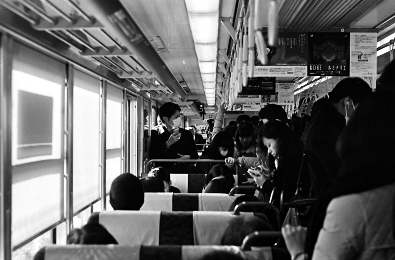 Passengers ride a train.