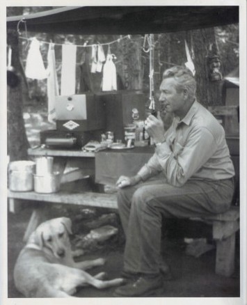 The author's grandfather, seated, with his dog