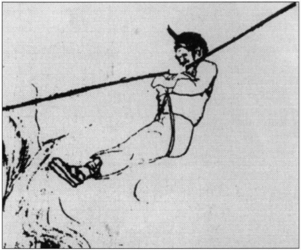 A man sits on a rope, and pulls himself over a chasm using a horizontally-mounted rope.
