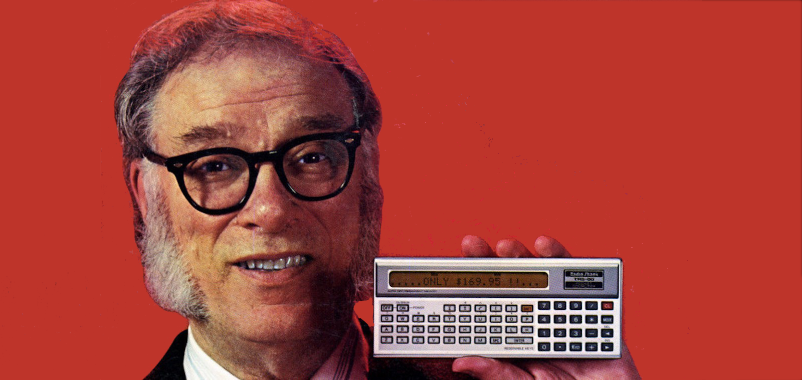 Isaac Asimov holds up a pocket calculator.