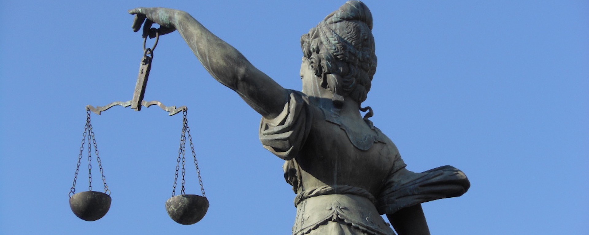 A statue of Lady Justice holding scales.