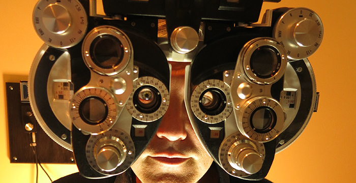 Steven Johnson wears a device for testing eyesight.
